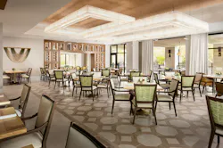 Dining room with grouped tables and dining chairs with arms, a wine display, and overhead canopy-style lighting