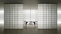 Syncro sliding panels transform room dividers into precise architectural elements.