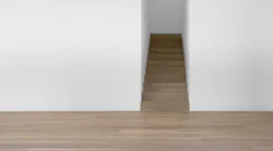 Oak Bois Flotté brings one refined French oak color across four formats. The flooring is shown installed on stairs.