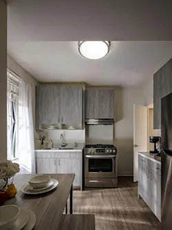 Kitchens were redesigned to improve flow and efficiency in compact units, with high-performance finishes, improved countertop and storage space, and stainless steel appliances to support modern living.