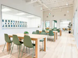 Adjacent homework, quiet zone with lockers, and treatment rooms remain visually open with interior glazing and larger glass panels.