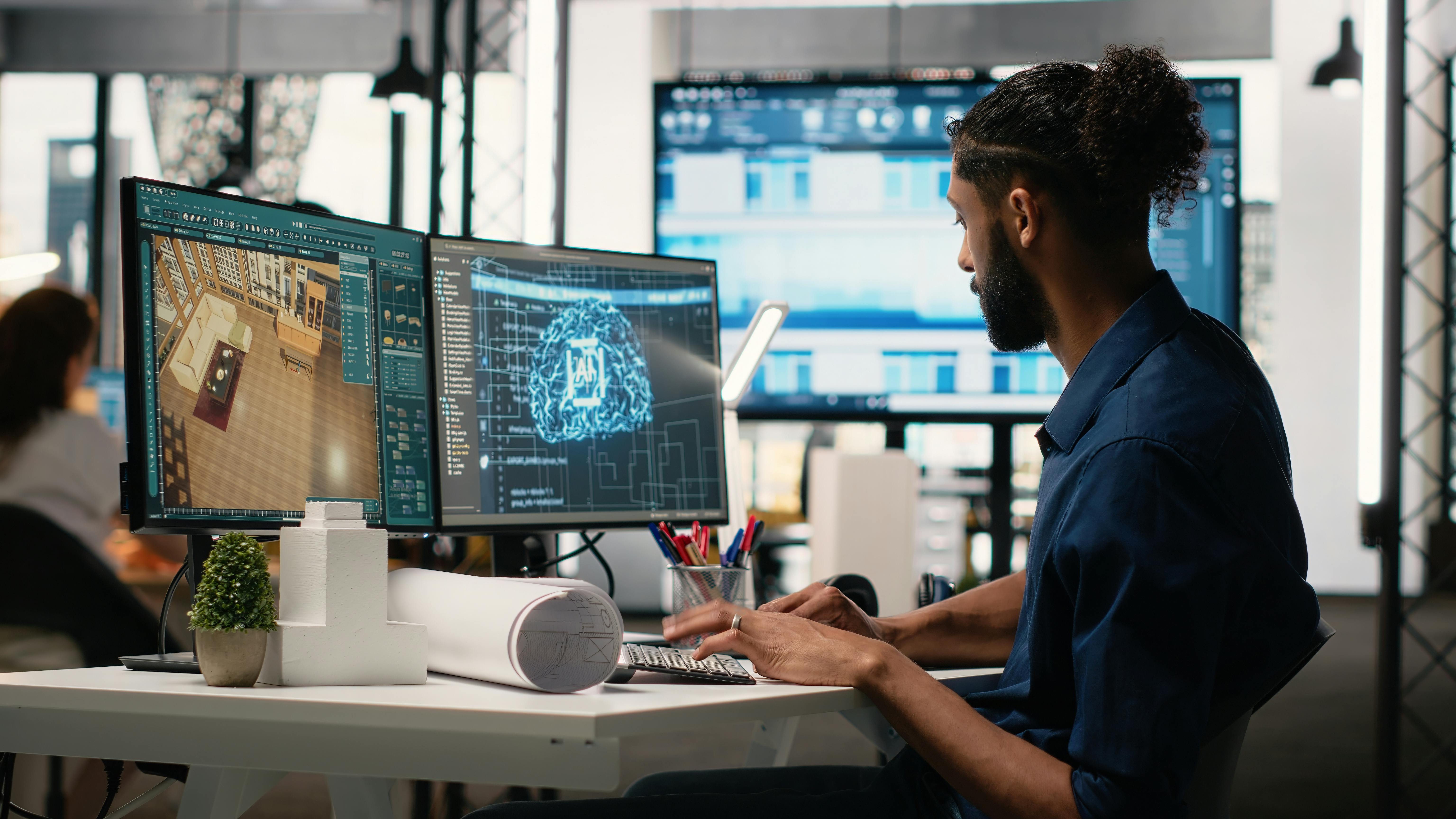 Designer in a corporate office using machine learning, cognitive computing and cybernetics to analyze blueprints and property layouts.