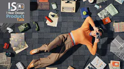 A woman lays on the floor, holding a View-Master, while surrounded by the Cult Classics collection from Shaw Contract.