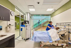 Nursing students practice care on a patient simulator in an intensive care environment
