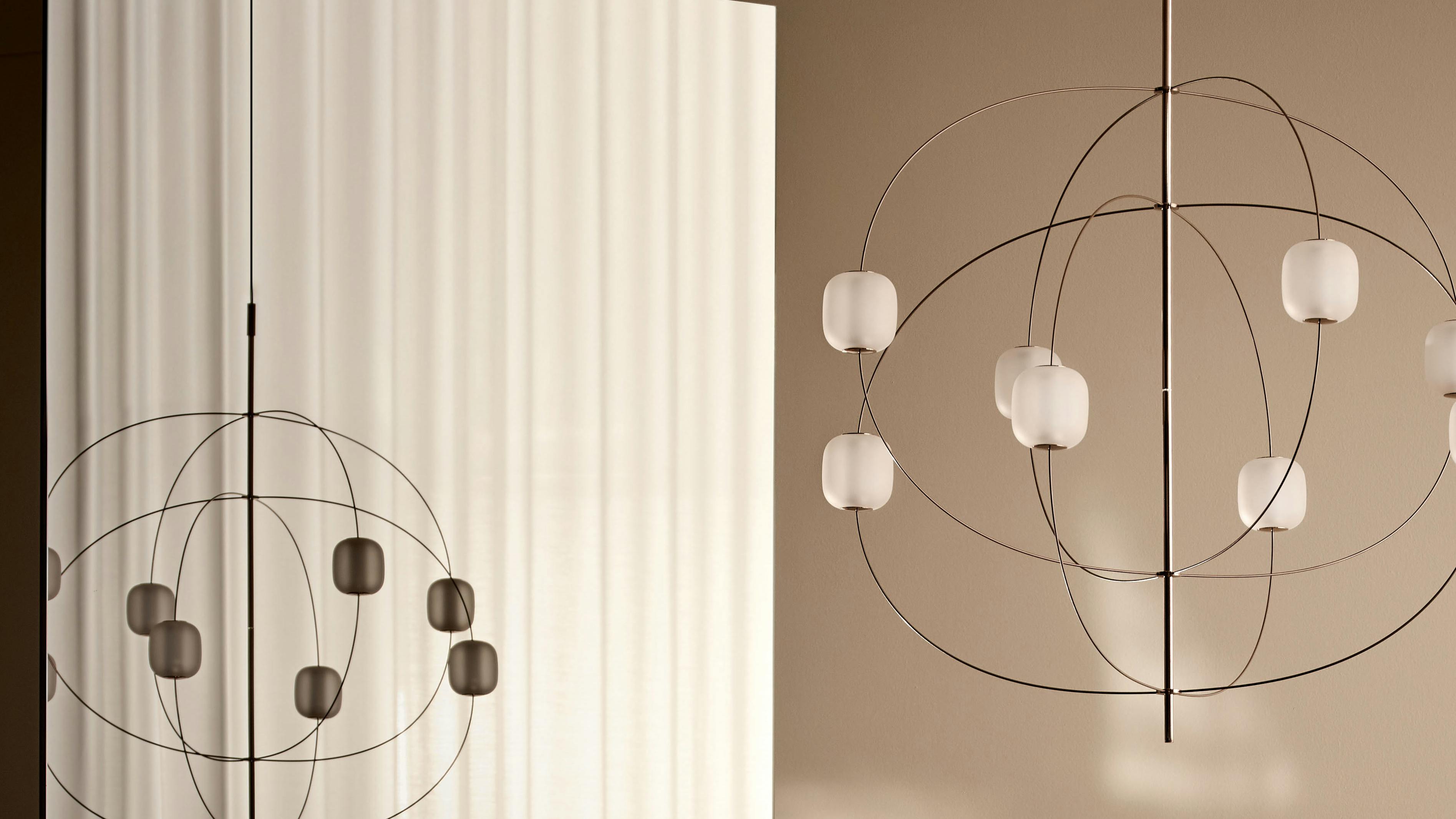 Axia's branching arms emerge from a central axis and come in two finishes.