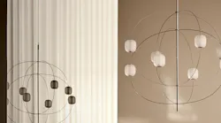 Axia's branching arms emerge from a central axis and come in two finishes.