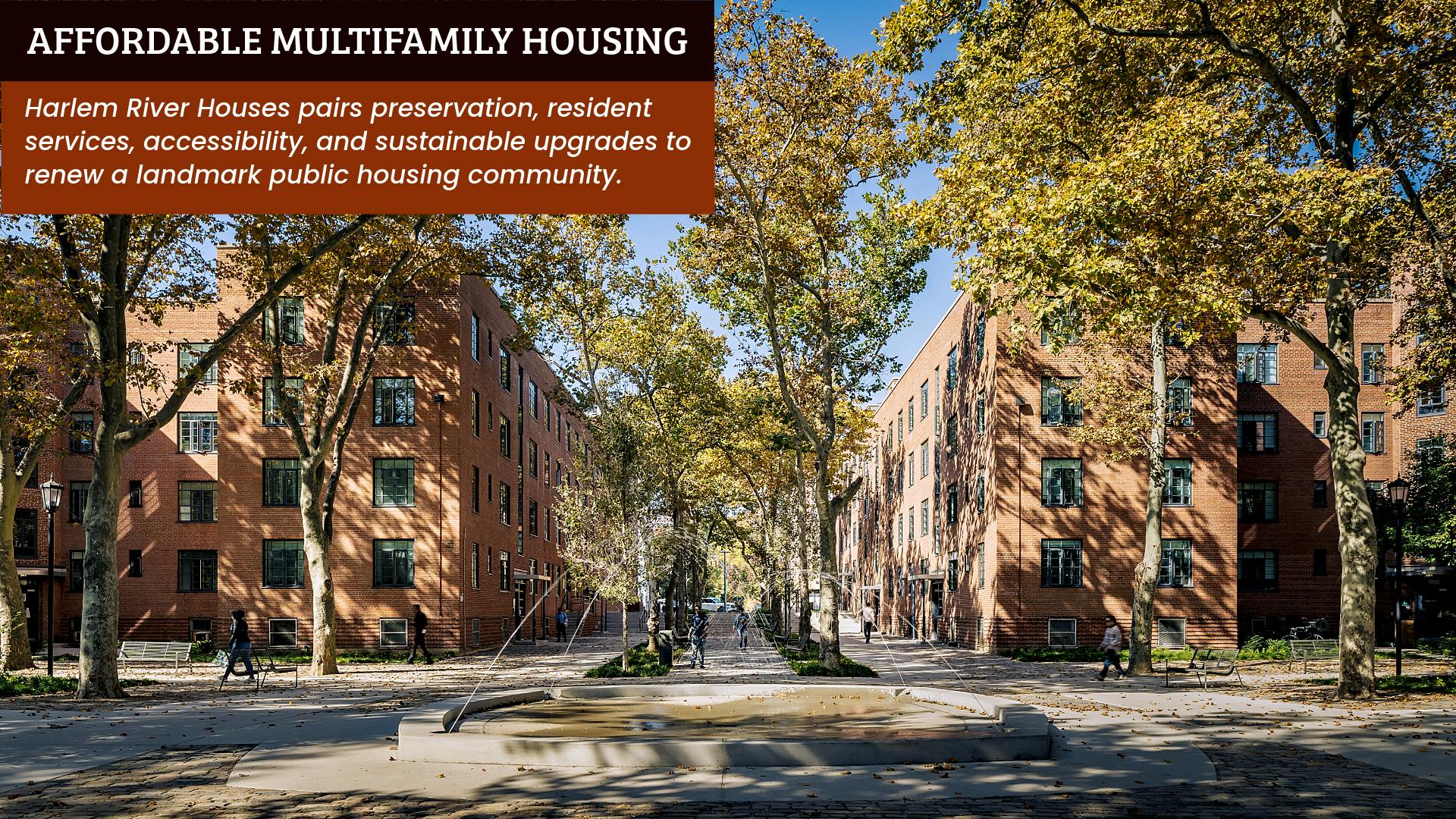Exterior courtyard view of restored brick buildings and fountain at Harlem River Houses
