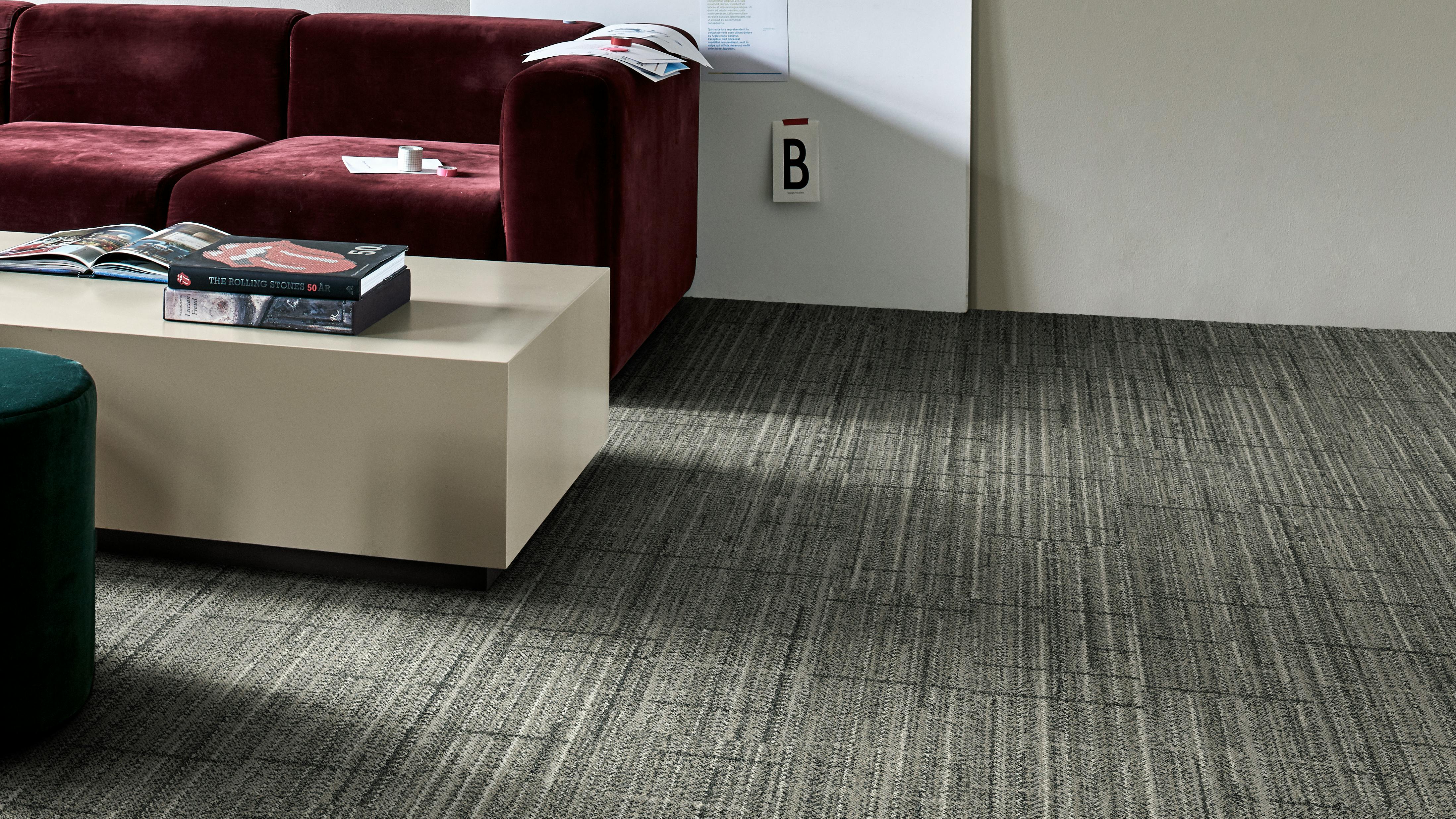 The In The Fold carpet tile from Interface's Twist &amp; Texture Collection installed in a living area.
