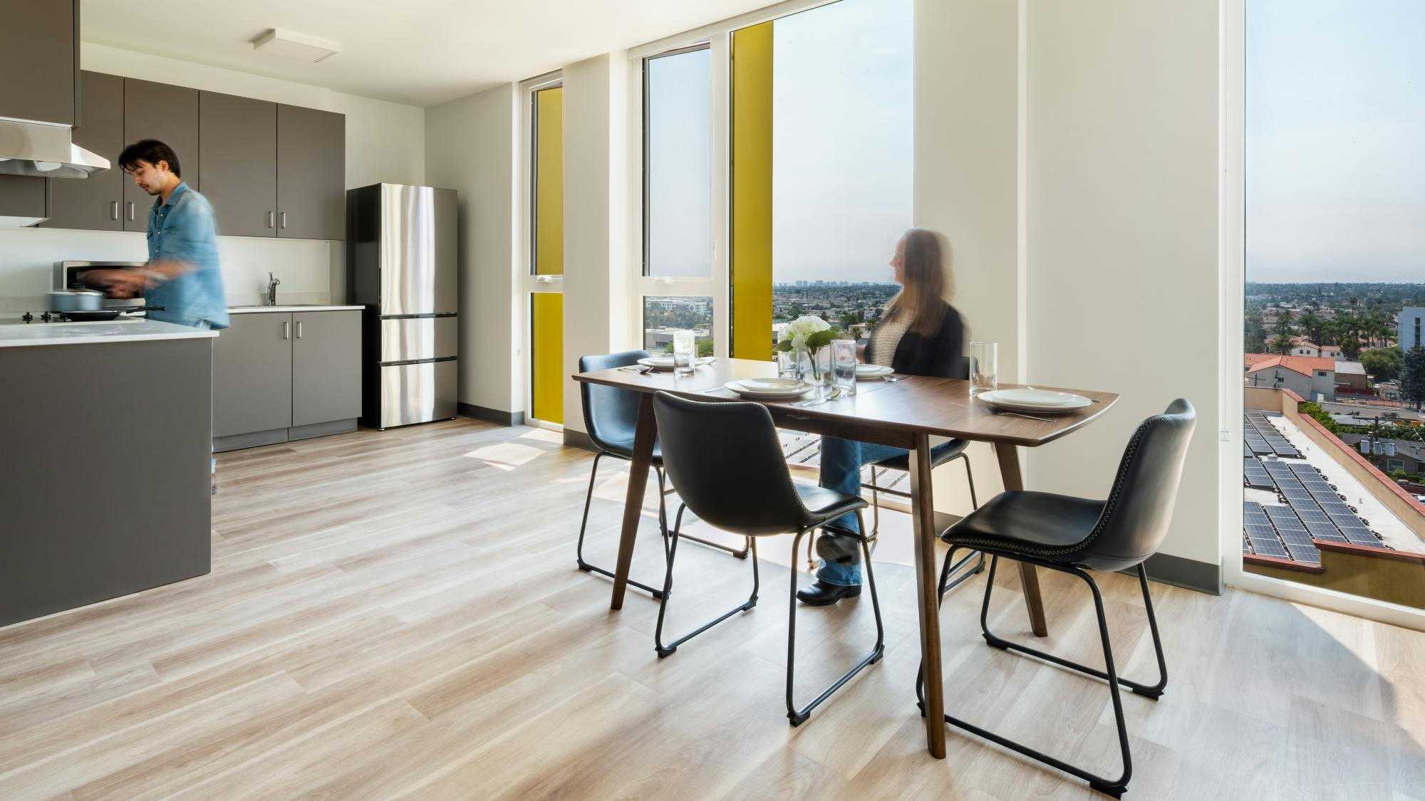 El Cerrito interior apartment kitchen view with large windows and neutral finishes