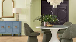 Celery-colored walls are painted in a dining room.