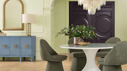 Celery-colored walls are painted in a dining room.