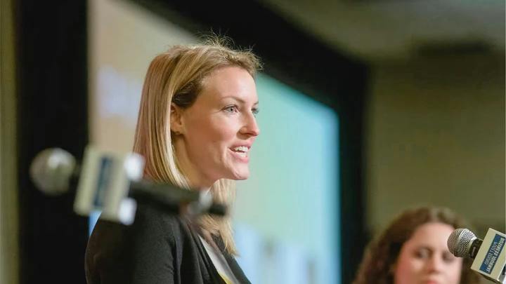 Hightower CEO Natalie Hartkopf presenting at event.